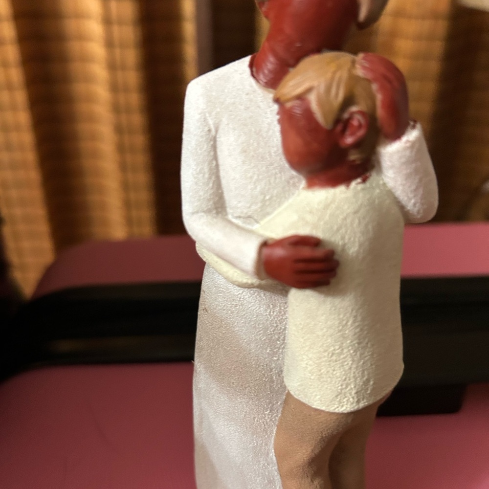 Heartwarming Figurine of a Mother and Son